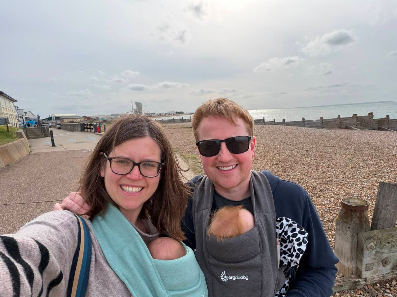 David and Laura smiling by the Whitstable seafront