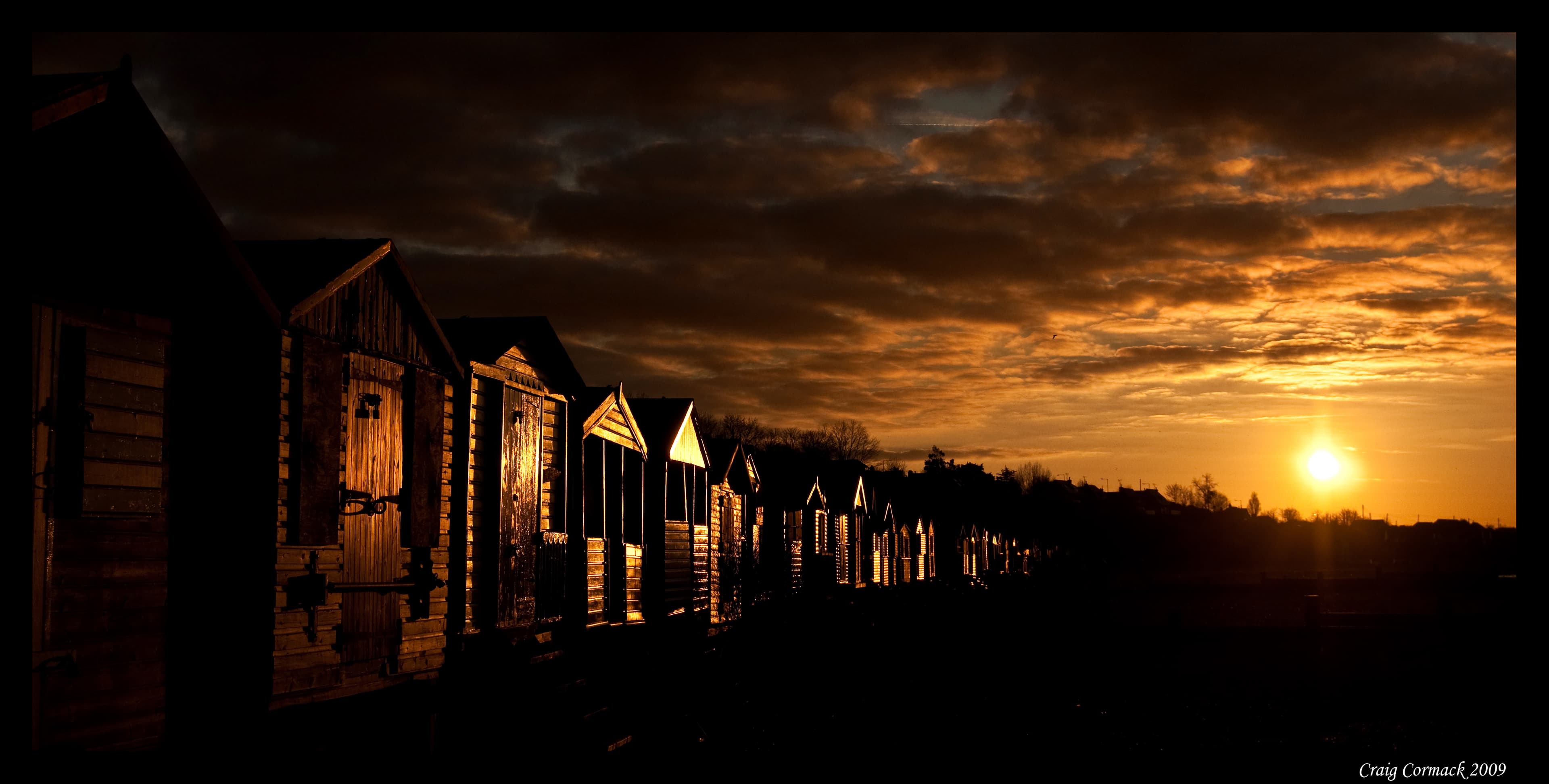 Whitstable beach huts at sunset